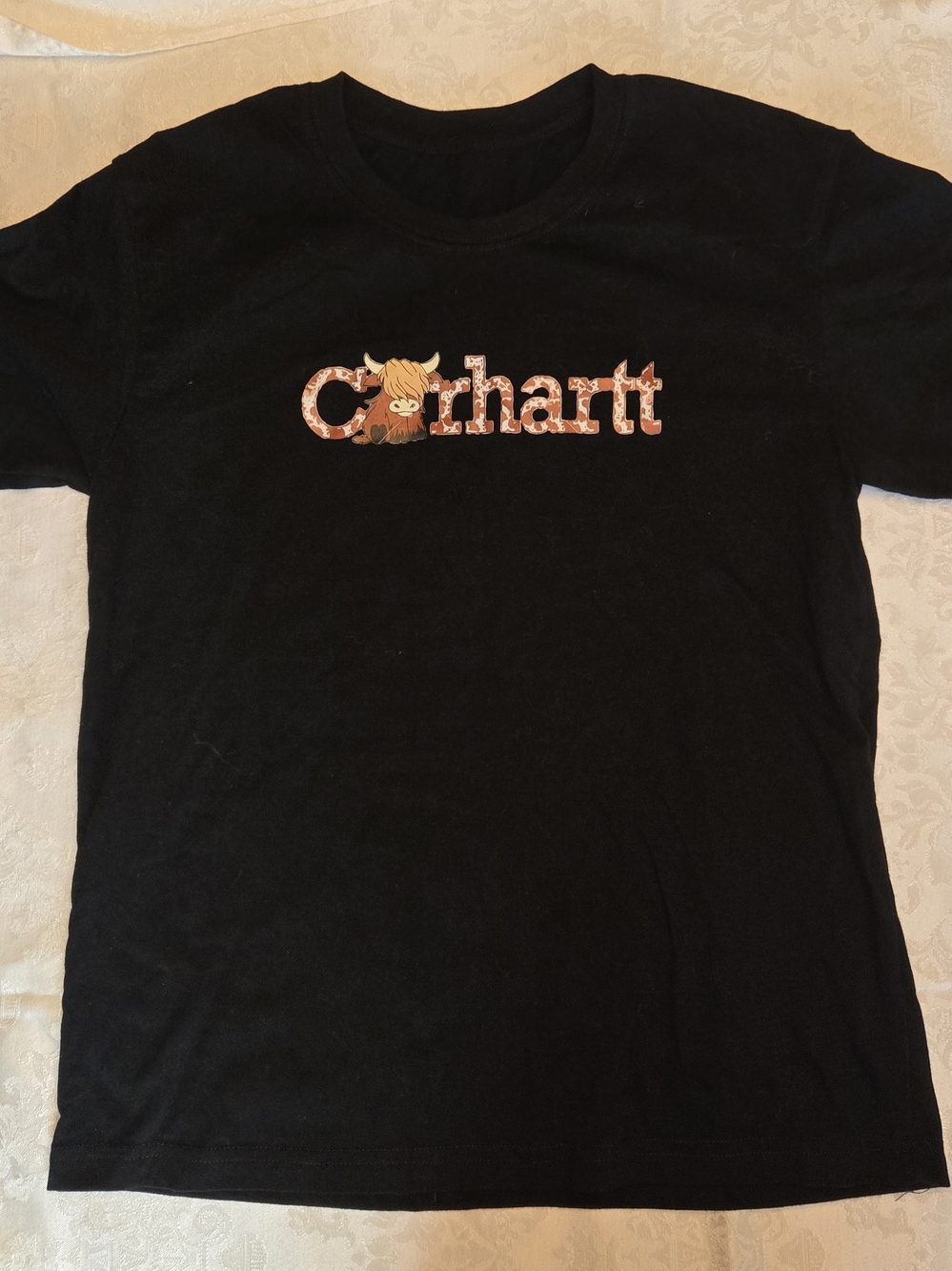 Carhartt Black Tee with Orange Patterned Logo and Highland Cow